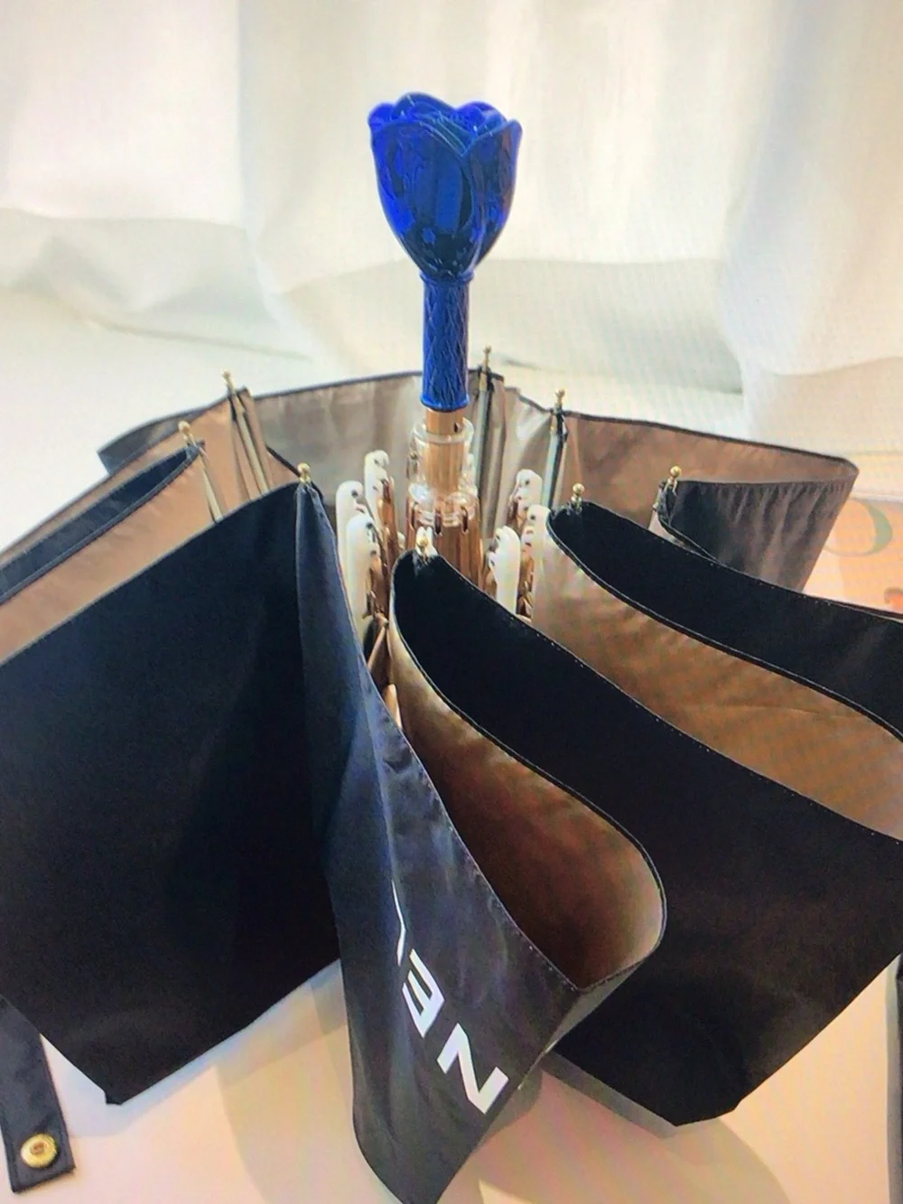 CHANEL Black Compact Umbrella with Blue Rose Handle